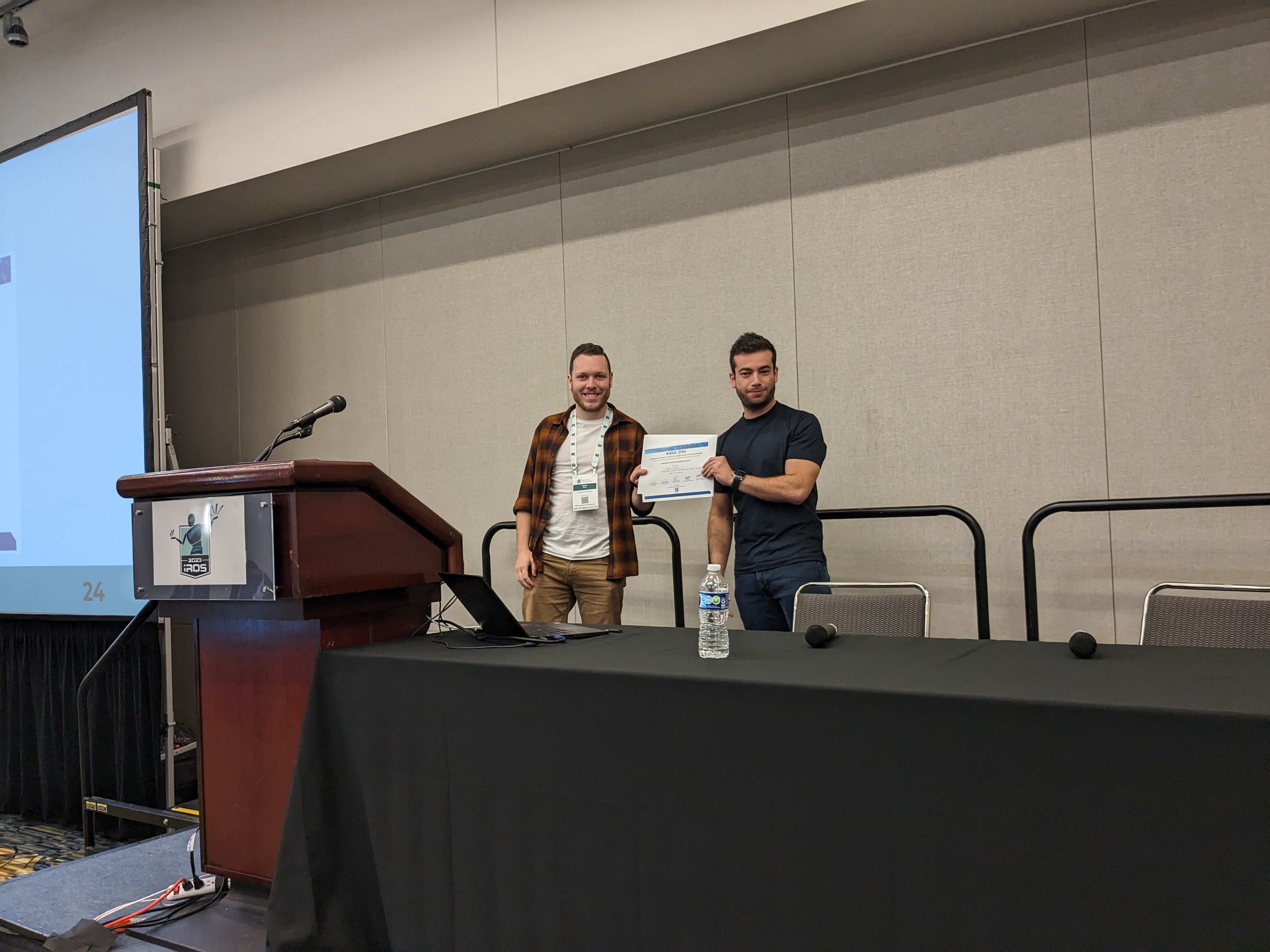 Parker Ewen (left) receiving the EAISI Best Poster Presentation Award from Rafael Papallas (right)